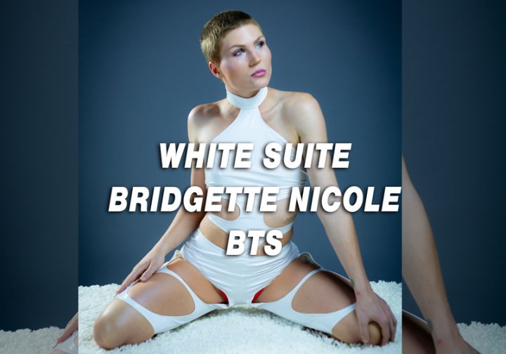 Bridgette Nicole wears a white suit with a title overlay.